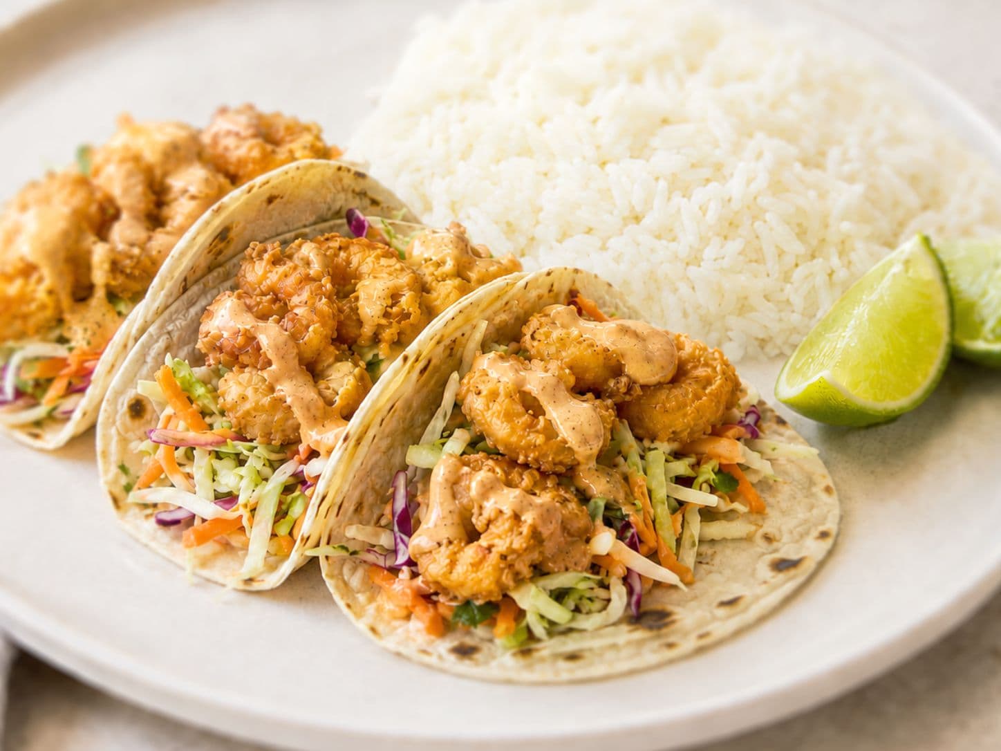 Crispy Bang Bang Shrimp Tacos with Zesty Slaw & Lime Rice